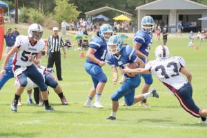 RWA quarterback Gunnar Hensley darts through a seam in the Laurens Academy defense. (Photo/Martha Ladd)