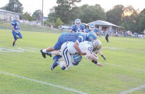 Webb Yongue (top) and Bryant Carvalho smother a General during Friday night’s romp. (Photo/Martha Ladd)