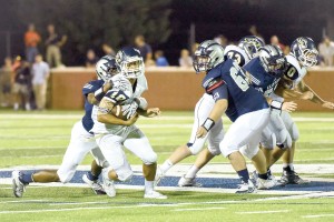 Kyle Wright (10) shakes a Clover tackle and breaks for the end zone. (Photo/Kristy Kimball Massey)