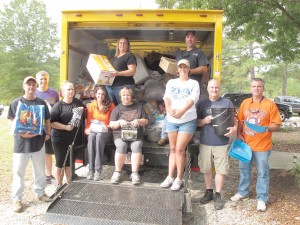 Packed up and ready to head for Clarendon County with relief supplies for flood victims, these Fairfield County volunteers are, standing: Kim and Randy Wilkes; from left: Ash Wilson, John Combs, Ashley Wilson, Erin Holmes, Angie Kelly, Rebekah Coleman, David Hendon, Russell Wilkes and (not pictured) Todd Mattox. (Photo/Barbara Ball)