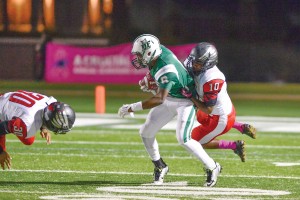  Richard Hall (30) takes a tumble while Erricey Canady (10) brings down Dutch Fork wide receiver Austin Connor, but not before the junior takes a Cole Douglas pass for a first down. (Photo/Ross Burton)