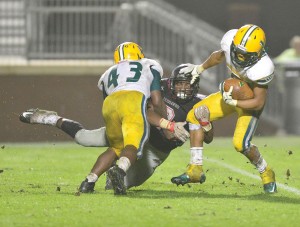 Malik Horton (9) gets the stiff-arm from Spring Valley's Tyjuan Fulton. (Photo/Ross Burton)