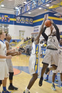 Akyel Richmond (23) draws the foul underneath the basket at Lexington Monday. (Photo/DeAnna Robinson)