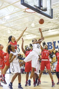 Westwood’s Essence Marshall (4) gets a hand in on Lauren Harley (22) as Harley goes for the rebound. (Photo/Kristy Kimball Massey)