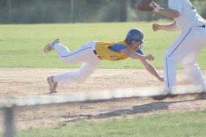 Noah Edwards dives back to first in Wednesday's deciding game at Wardlaw. (Photo/Kay Hensley)