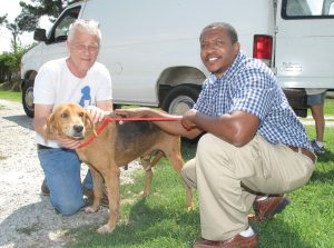 Bob Ennis, Shelter Manager for Pets, Inc. and new Fairfield County Animal Shelter Director James Hill with one of 29 dogs taken from the Fairfield shelter in the last 10 days by two rescue organizations, Pets, Inc. and Ozzie to the Rescue, and placed in safe havens where they will receive shots, be altered and cared for until they can be adopted. Clearing of the dogs from the shelter was facilitated by The Hoof and Paw Benevolent Society.