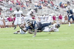 Roger Carter (88) takes a Jordy Adams pass and lunges for the first down. (Photo/Kristy Kimball Massey)