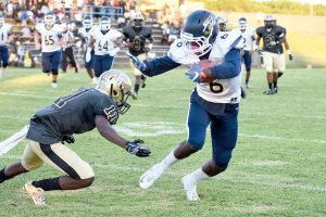 Blythewood's Kameron Riley (6) slips the tackle attempt by Quay McBride (11) and takes Jordyn Adams' pass in for the score. (Photo/Kristy Kimball Massey)