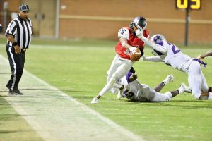 Bradlee Nelson (15) toes the sideline while the Ridge View defense gets away with a facemask. (Photo/Ross Burton)