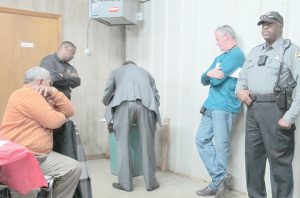 Jenkinsville Water Company Board President Gregrey Ginyard (left) looks on as ballots are counted during last week's annual meeting. (Photo/Barbara Ball)